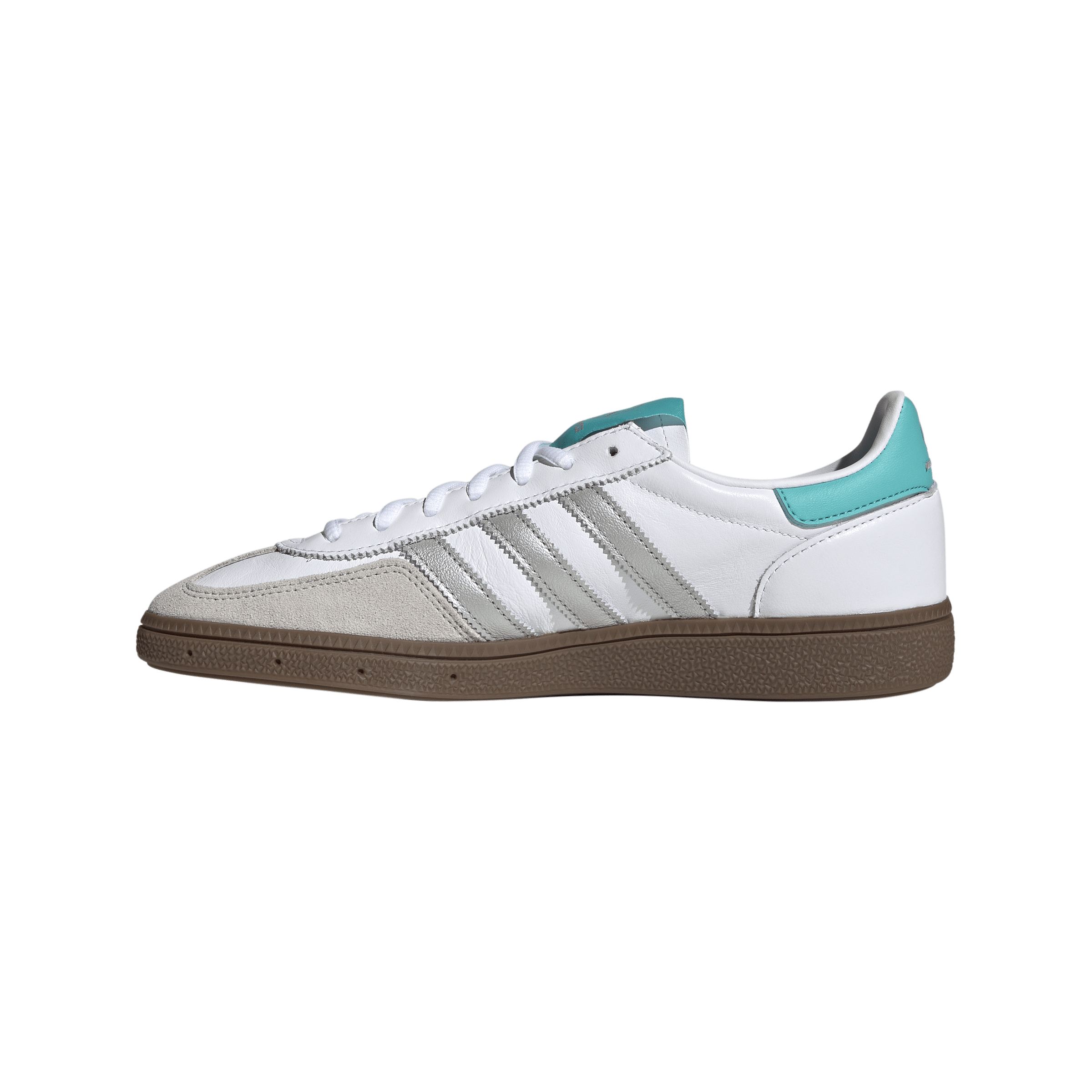 White sneaker with teal heel patch and gray three stripes, gum outsole visible at the bottom edge (partial view).