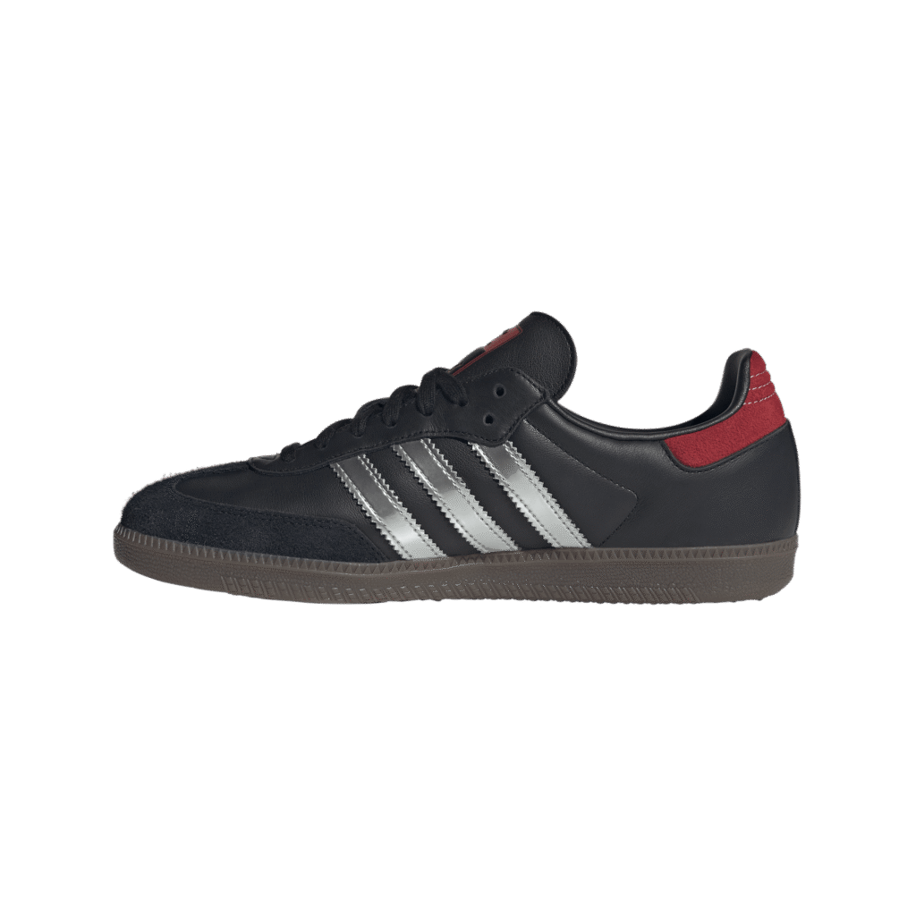Close-up of a black sneaker with white 3 stripes and a red heel cap alternating in view