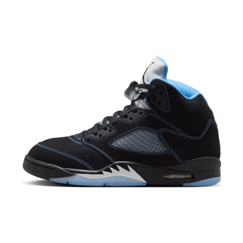 Close-up of a black sneaker with blue lining and a visible air-cushed midsole component, shown from the side.